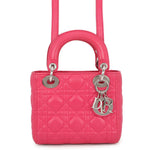 Mini Lady Dior pink Cannage leather bag with rounded top handles, silver-tone D.I.O.R. charms and matching shoulder strap, front view