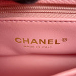 Close-up of a Chanel Coco leather interior with gold-embossed CHANEL branding and 'MADE IN ITALY' text.