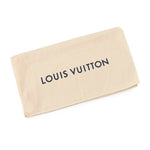 A beige Louis Vuitton dust bag with the brand name