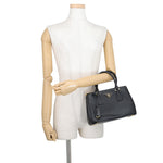 Prada Saffiano Leather Galleria Tote in Black displayed on mannequins arm— Pre-Owned Designer Handbag