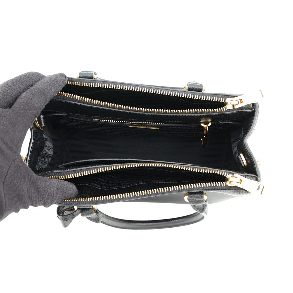 Prada Saffiano Leather Galleria Tote in Black interior view showing its multiple compartments and zippers — Pre-Owned Designer Handbag