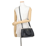Prada Saffiano Leather Galleria Tote in Black worn as crossbody bag with its detachable strap — Pre-Owned Designer Handbag