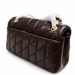 Coach Quilted Tabby 26 shoulder bag in maple color showing its back side view featuring exterior slip pocket and diagonal quilting⁠
