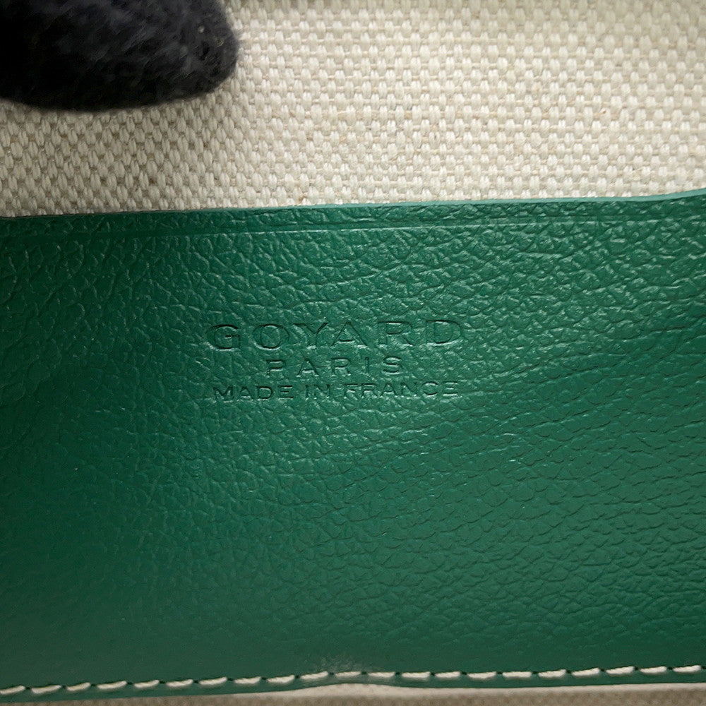 Heat stamped Goyard Paris Made in France logo on green interior calfskin leather pocket.
