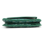 Bottom view of the Goyard Plumet green crossbody showing the multi-compartment gusset structure.