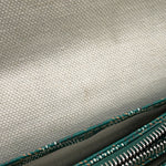 Interior view of the Goyard Plumet bag open showing linen lining, card pocket, and zip pouch.