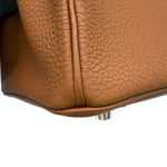 Close-up inspection of lower corner leather piping on Hermès Birkin 25