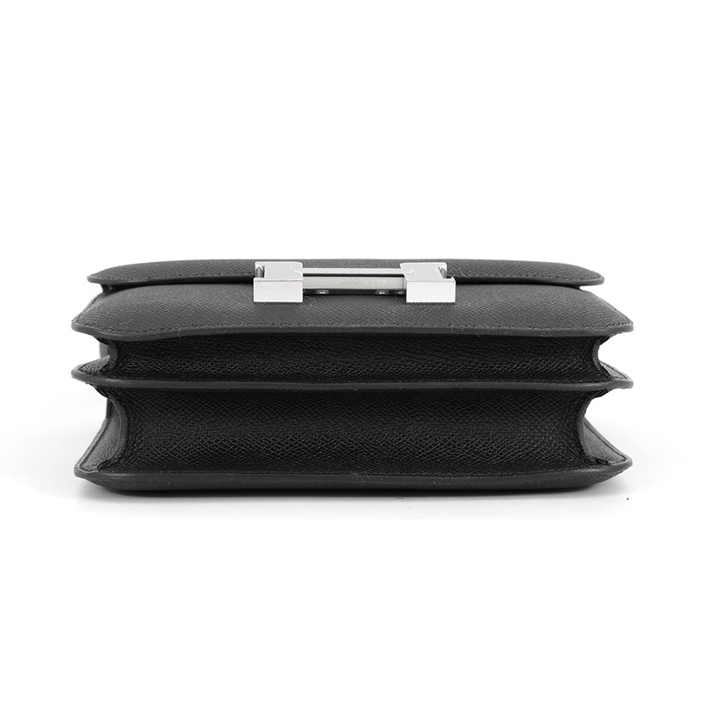 Bottom view of the black Epsom Hermès Constance 18 showing double compartment gusset design.