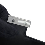 Close-up of protective plastic film on the Palladium hardware clasp of the unused Hermès Constance 18.