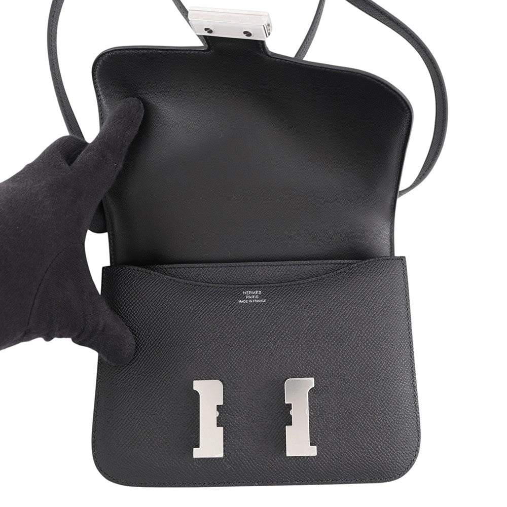 Hermès Constance 18 open flap revealing silver foil Hermès Paris Made in France heat stamp.