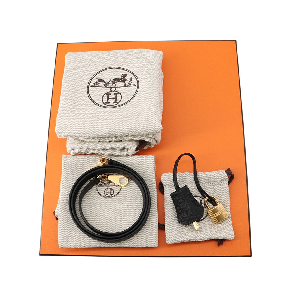 Hermès Kelly 25 complete set including orange box, dustbags, shoulder strap, lock, and keys