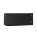 Bottom base of Hermès Kelly Sellier 25 showing Black Epsom leather and protective metal feet
