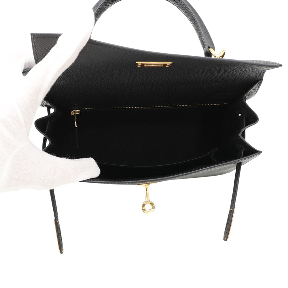 Inside open compartment of Hermès Kelly Sellier 25 Black Epsom leather handbag