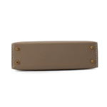 Hermès Mini Kelly 20 bottom base view showing gold protective feet⁠