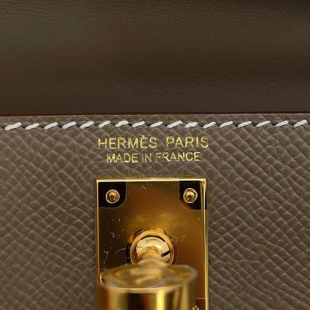 Hermès Mini Kelly 20 Étouppe Epsom gold foil logo stamp and yellow gold hardware turnlock with protective seal⁠