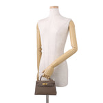 Hermès Mini Kelly II 20 Sellier modeled on mannequin for size comparison⁠