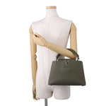 Louis Vuitton Capucines BB held by top handle on mannequin for size reference