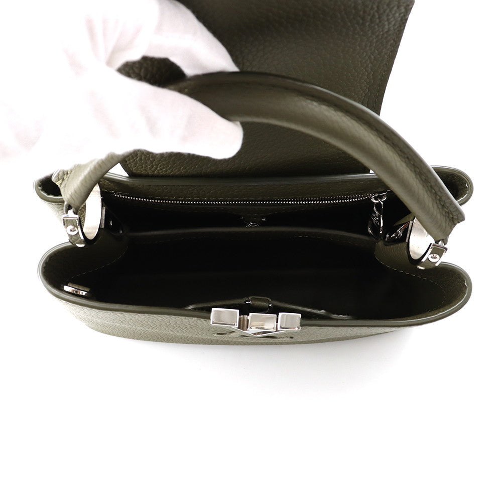 Top-down view into open compartments of Louis Vuitton Capucines BB bag