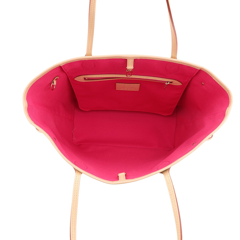 down view inside Louis Vuitton x Murakami Neverfull MM showing bright fuchsia pink canvas lining