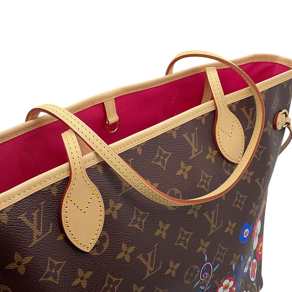 Close-up of pale Vachetta leather shoulder handles and yellow stitching on Louis Vuitton Neverfull MM