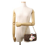 Louis Vuitton x Takashi Murakami Panda Pochette Accessoires modeled on mannequin with gold chain strap⁠