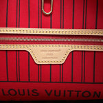 Close-up of interior leather heat stamp reading Louis Vuitton Paris made in France on Neverfull MM