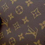 Close-up texture view of Louis Vuitton LV Monogram coated canvas