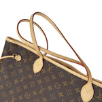 Close-up view of twin Vachetta leather shoulder handles on Louis Vuitton Neverfull MM