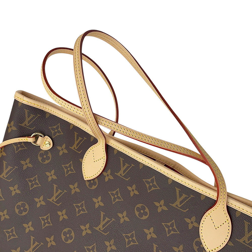 Close-up view of twin Vachetta leather shoulder handles on Louis Vuitton Neverfull MM