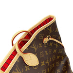 Detail of Vachetta leather side cinch lace and top rim binding on Louis Vuitton Neverfull MM