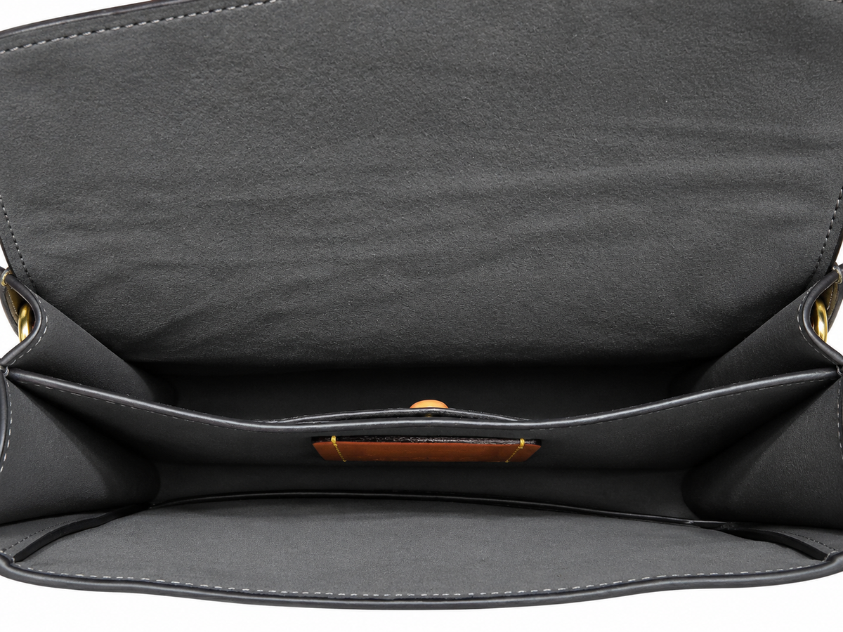 Interior view of the preowned Coach Chain Tabby shoulder bag showcasing clean fabric lining and divider pocket.
